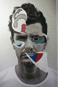 Man's face collaged with cool images on paper